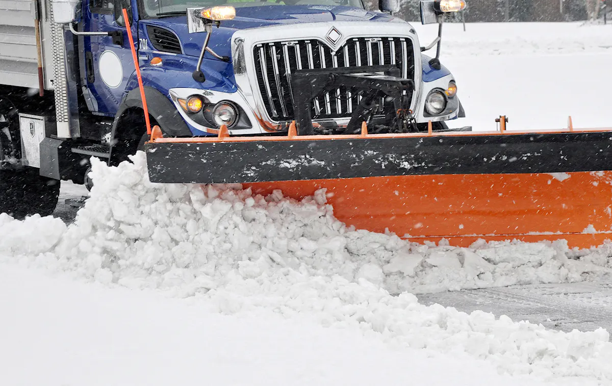 KBS teams plow snow on a commercial property