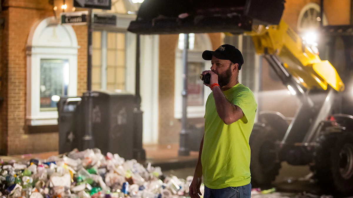 A KBS/Empire Services crew member manages operations during the clean up at Mardi Gras